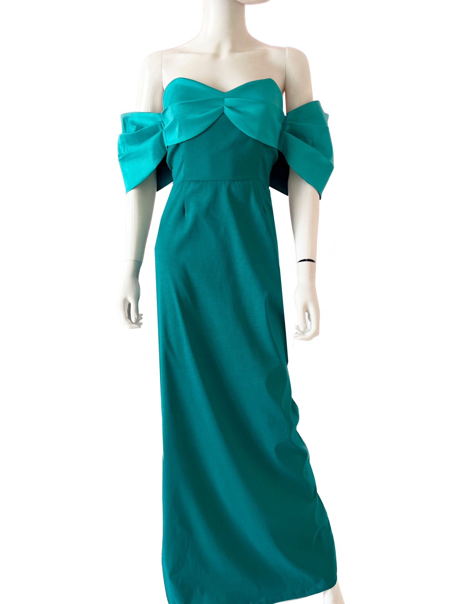 Vestido moño en brazos turquesa.