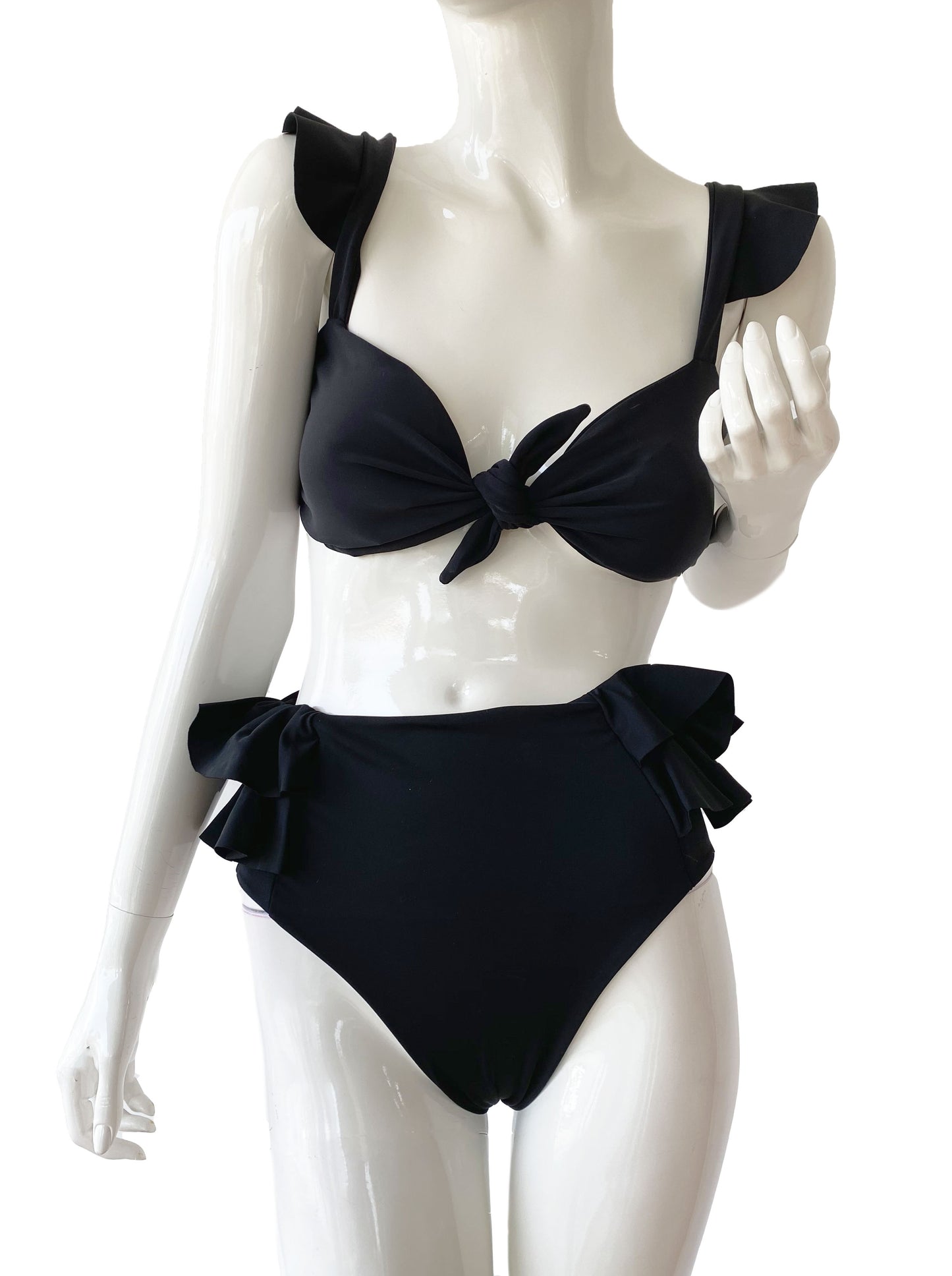 Top nudo volantes negro.